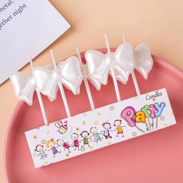 white ribbon candle